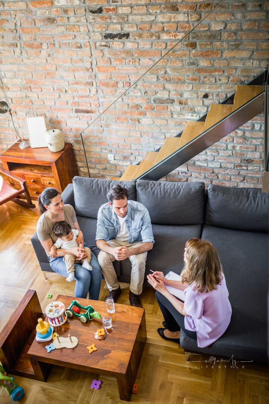 Young couple with a child in a couples therapy session
