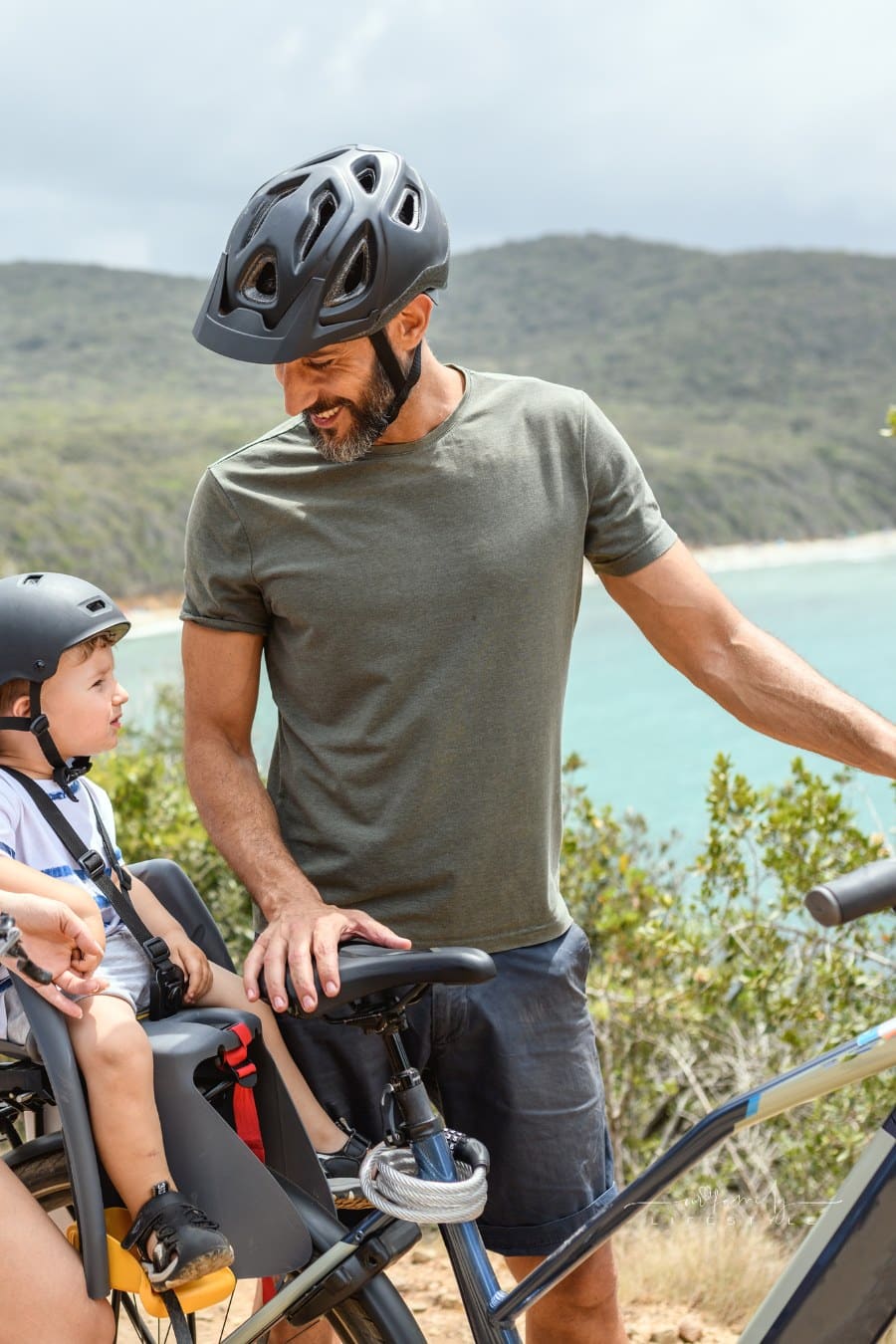 Family with toddler using e-bike in Tuscany, Italy