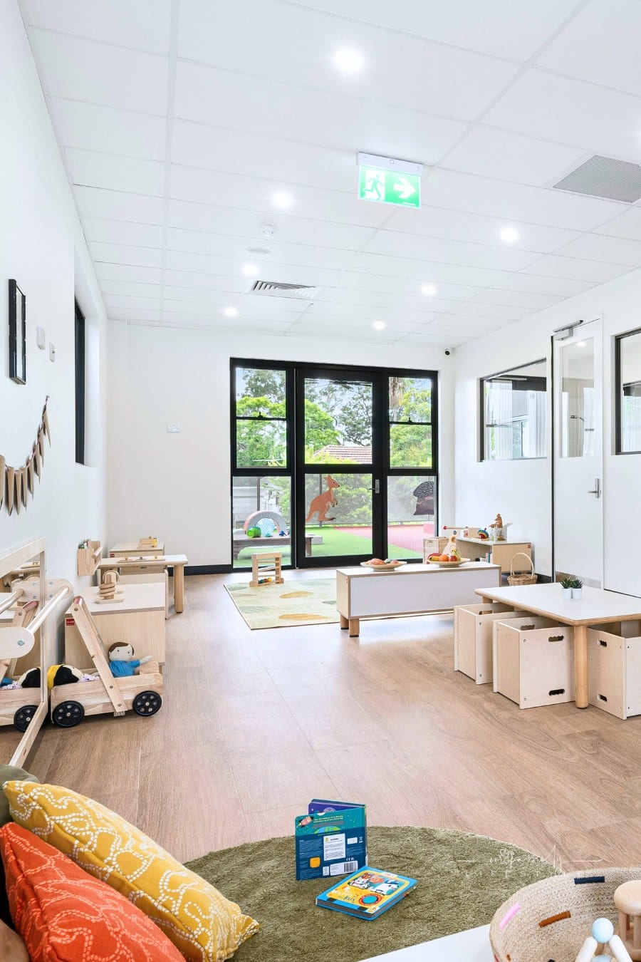 bright, neat toddler playroom in childcare center