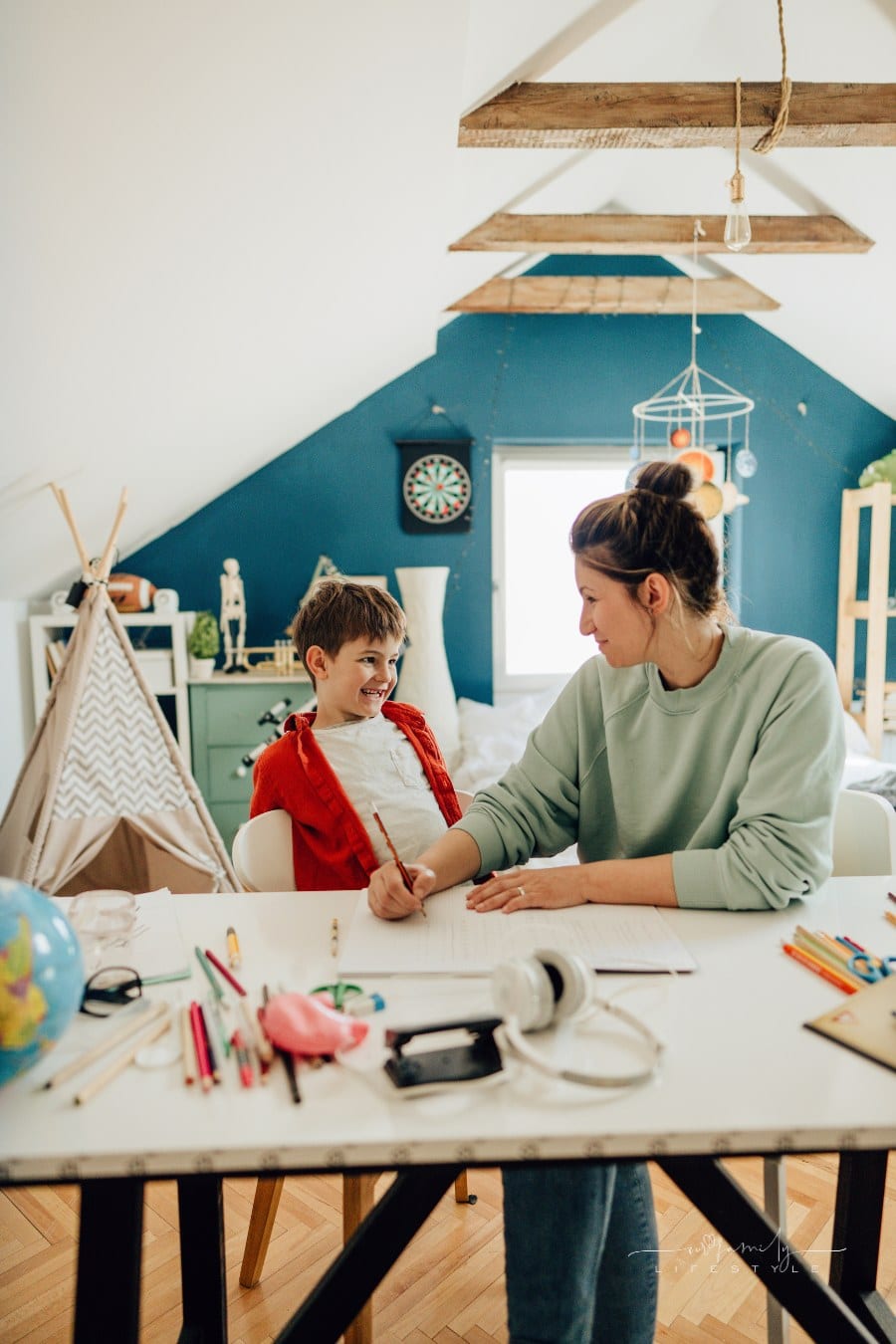mother and son learning together while homeschooling