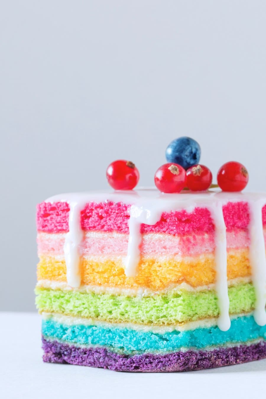 Slice of Rainbow Layered Cake