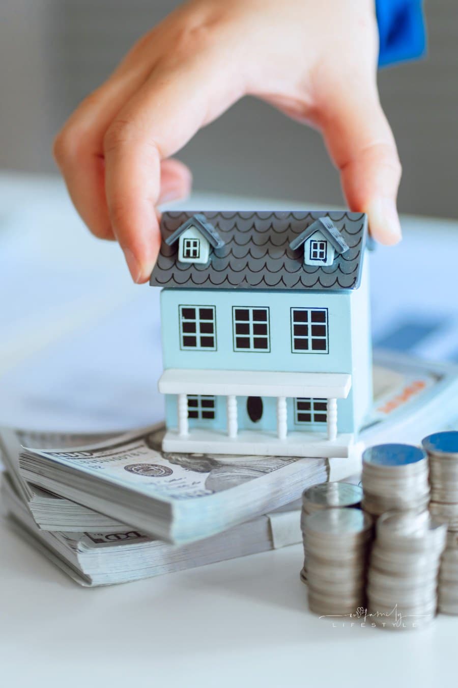 Saving Money for Real Estate Investment with with Stack of Money