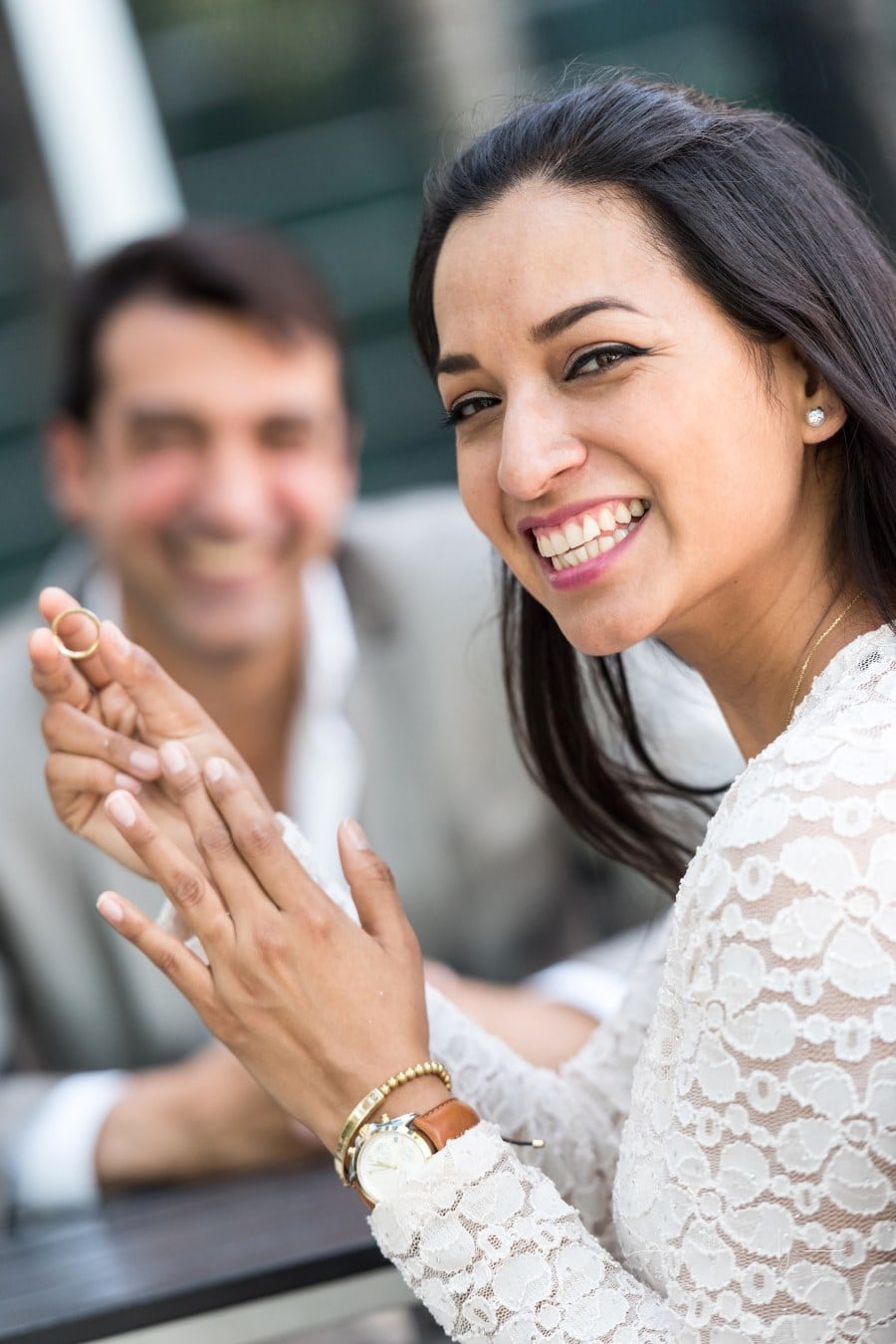 young woman showing off engagement ring