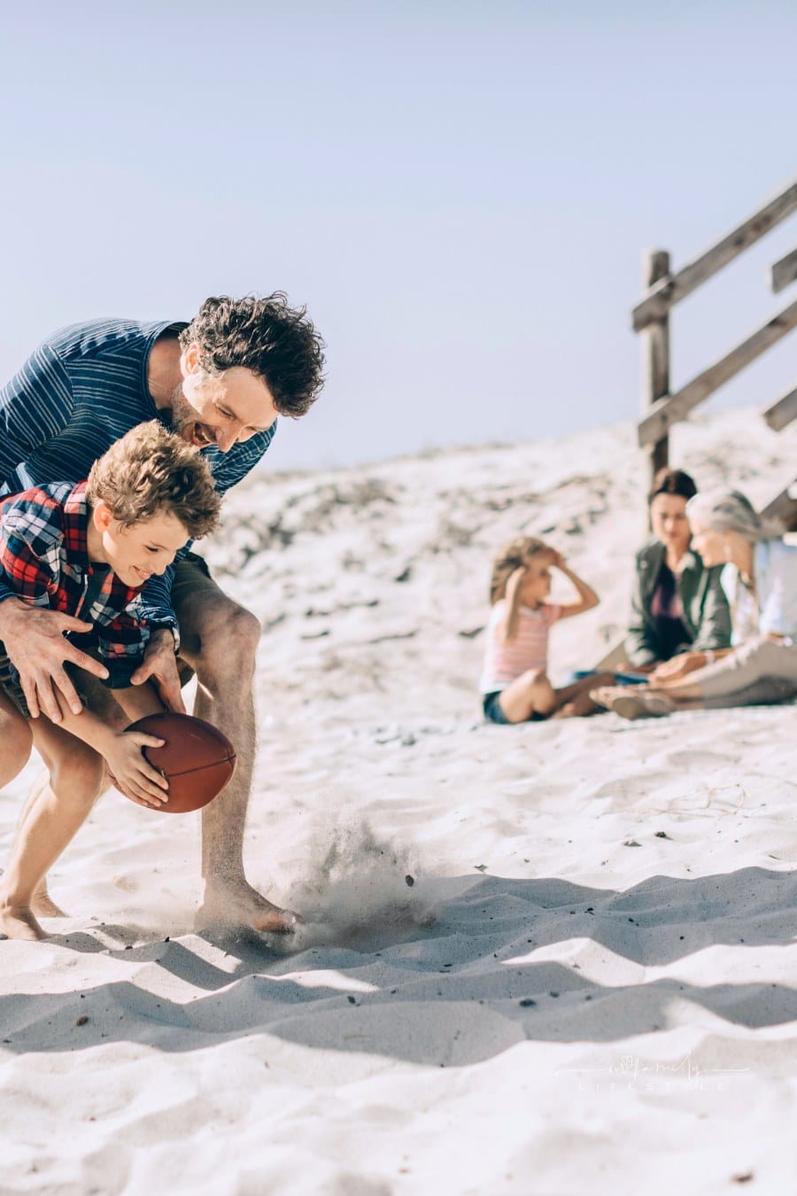 playful family beach photo shoot