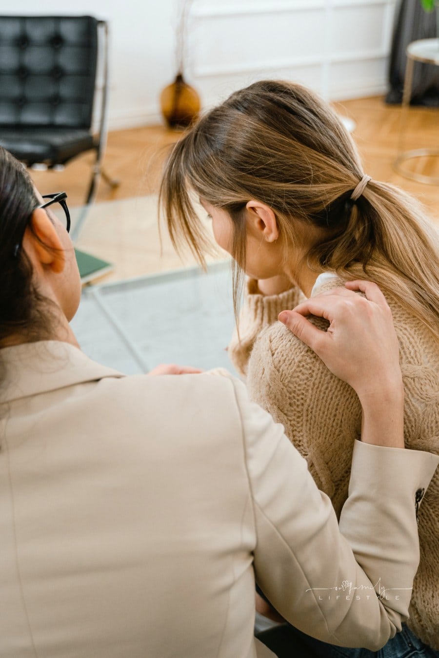 Back View of Person Comforting Her Friend