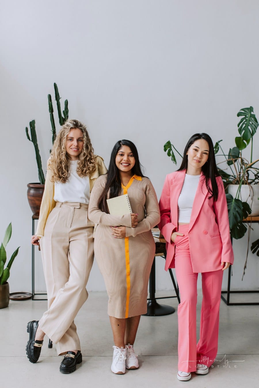 business women of varying body types in colorful suits