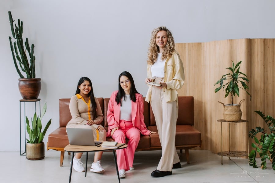 business women of varying body types in colorful suits