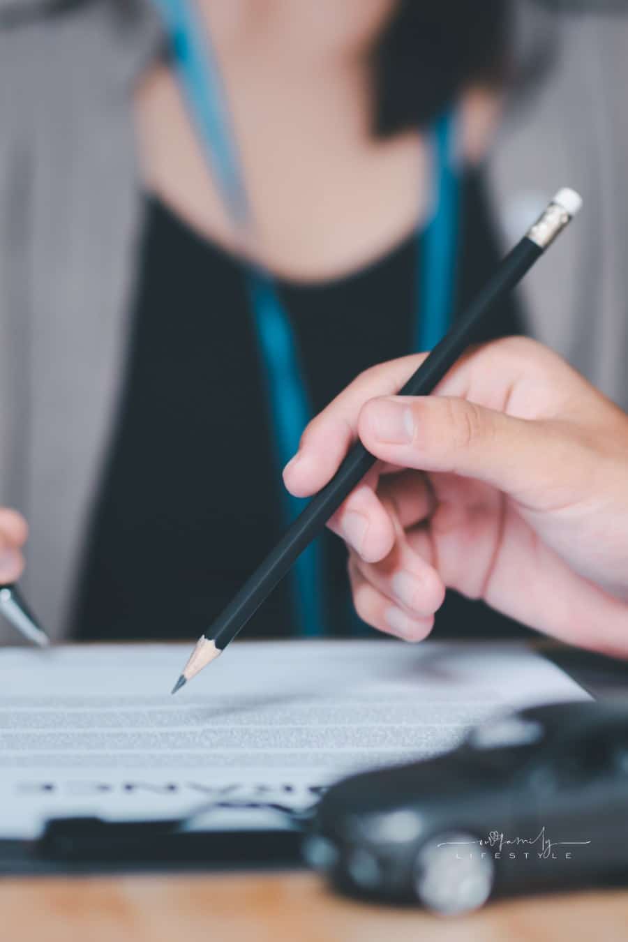 woman signing car insurance contract 