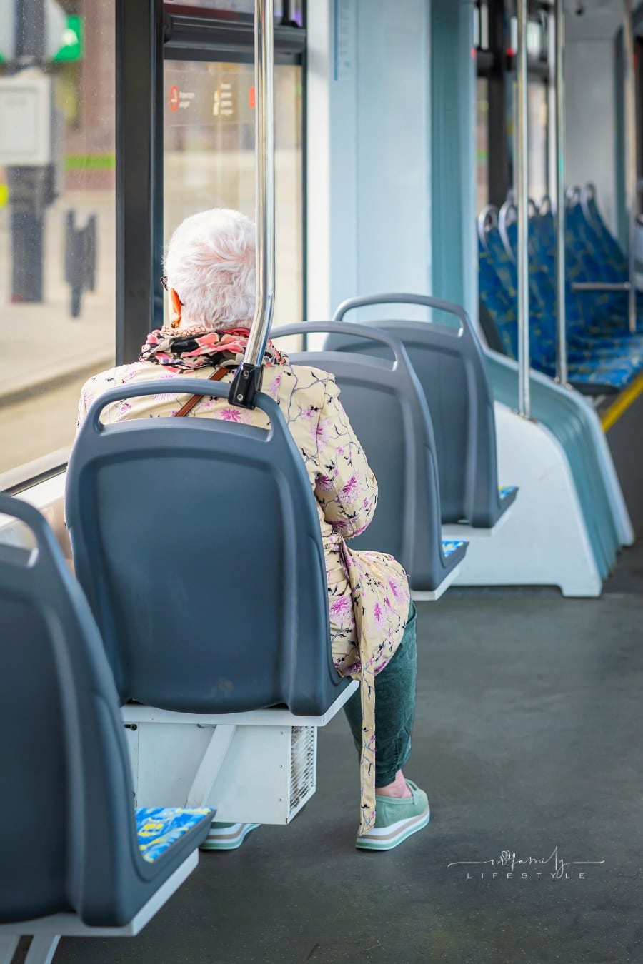 Unrecognizable Elderly Woman Sitting inside Tram, Concept of Age, , Seniors, Public Transport