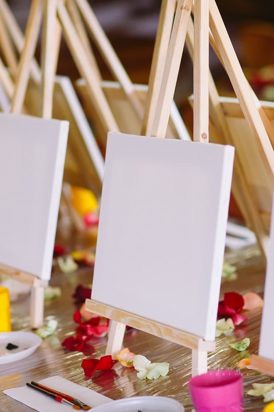 blank canvases set up on table in preparation for painting party