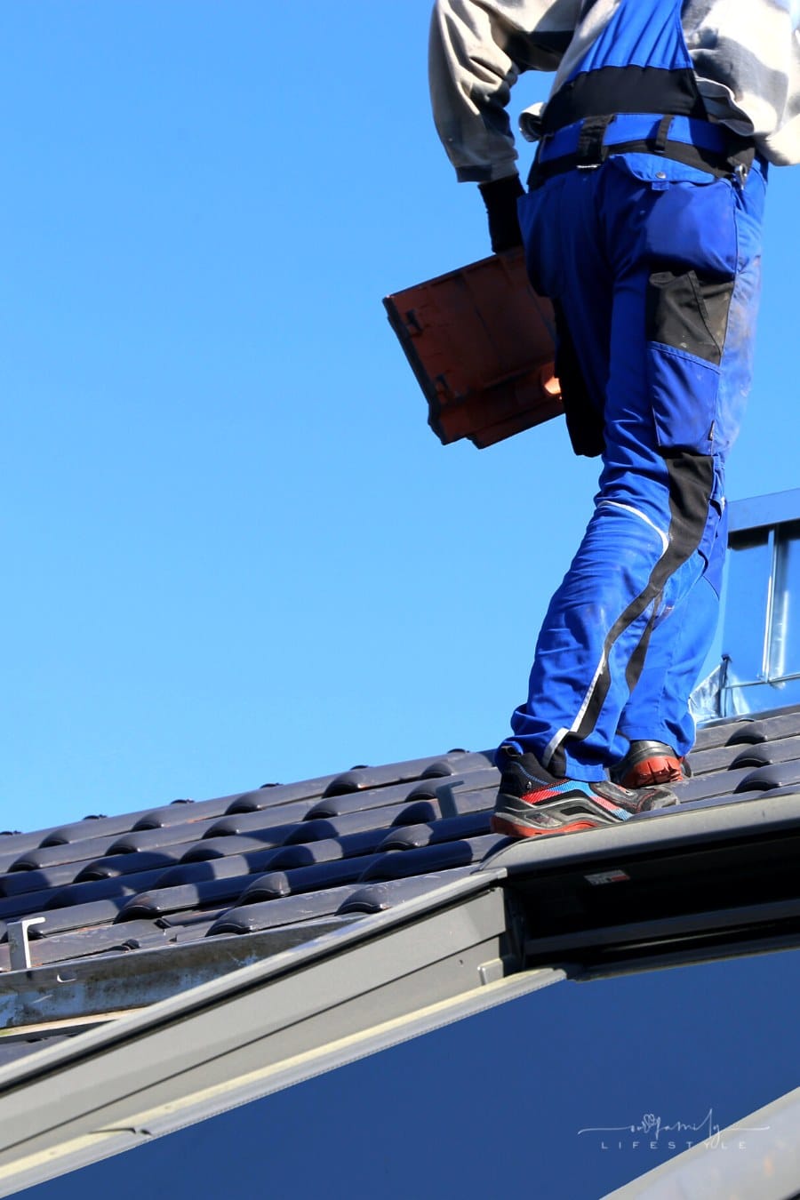 house inspector walking on roof