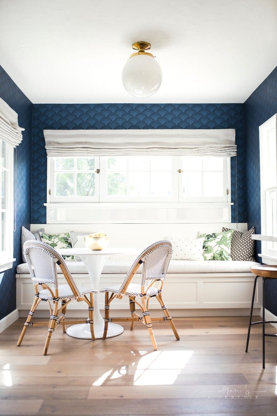 blue wallpaper in bright dining room