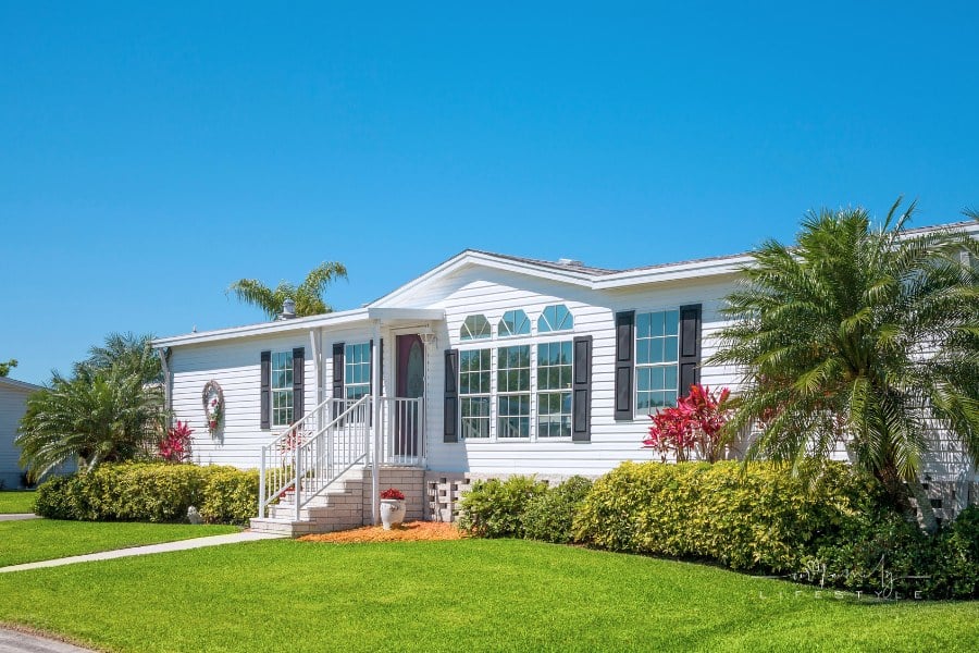 mobile home with landscaped yard