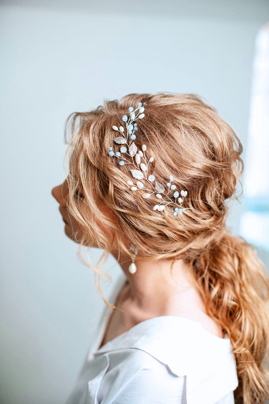 Hairstyle with a Hair Accessory on Long Wavy Hair and earrings