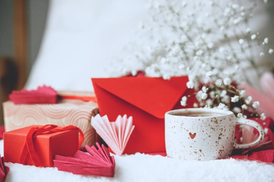 Happy valentines day! Cute stylish cup of tea with heart on cozy