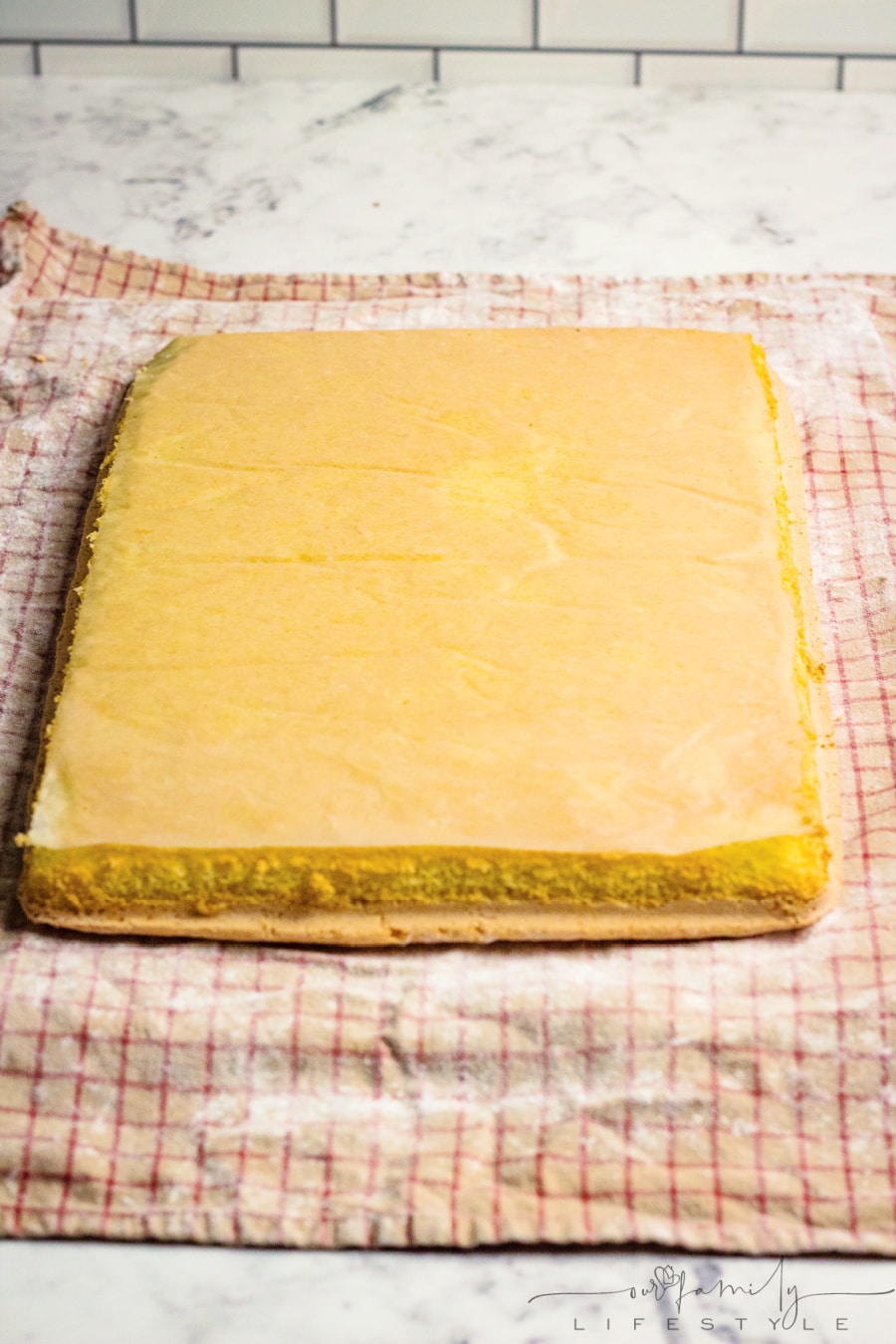 immediately turn cake roll onto dishtowel sprinkled with powdered sugar