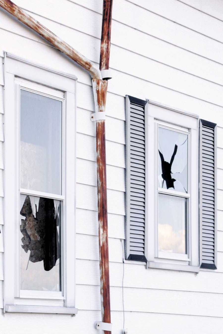 broken windows on house exterior