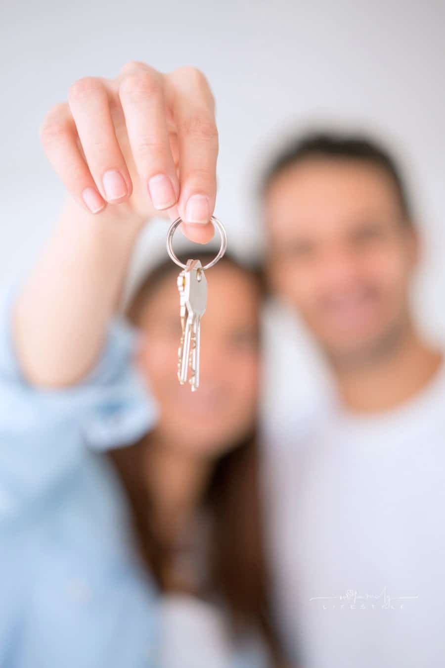 Couple holding house keys