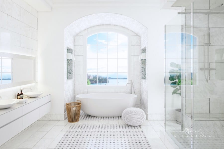 Modern luxury white bathroom with stand alone tub, wall-mounted vanity, and frameless shower