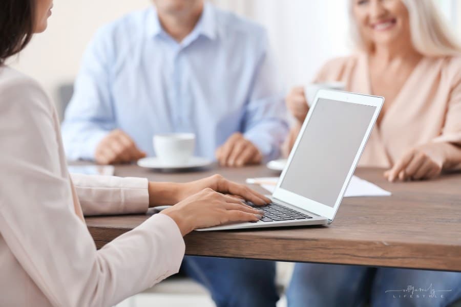 Female insurance agent consulting clients in office