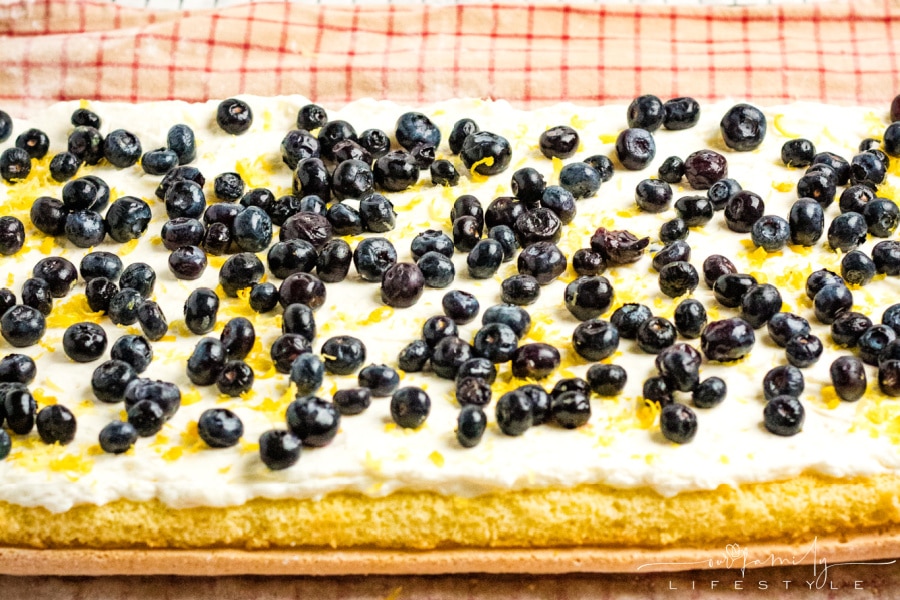 lemon filling topped with blueberries in Swiss roll