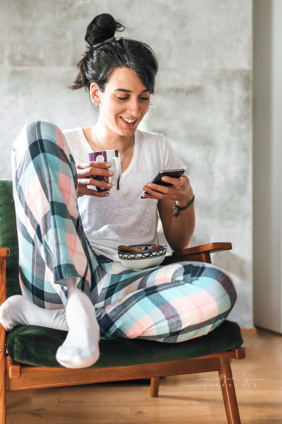 Young Woman Using Her Smartphone at Home