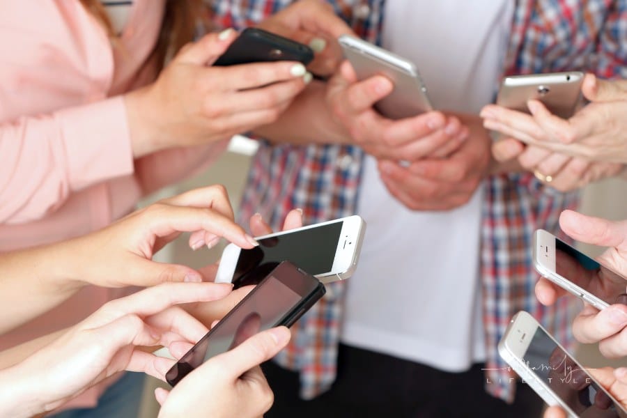 Many Hands Holding Mobile Phones