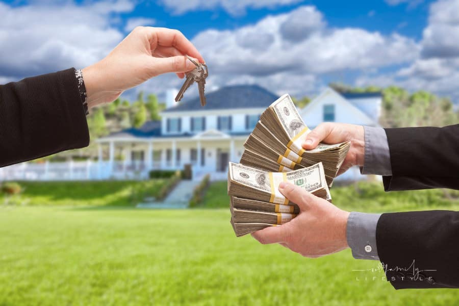 Man Handing Woman Cash for House Keys