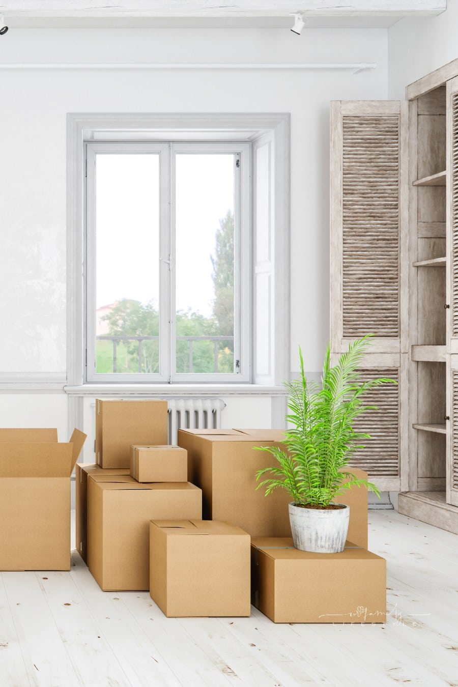 Modern empty home interior with cardboard boxes.