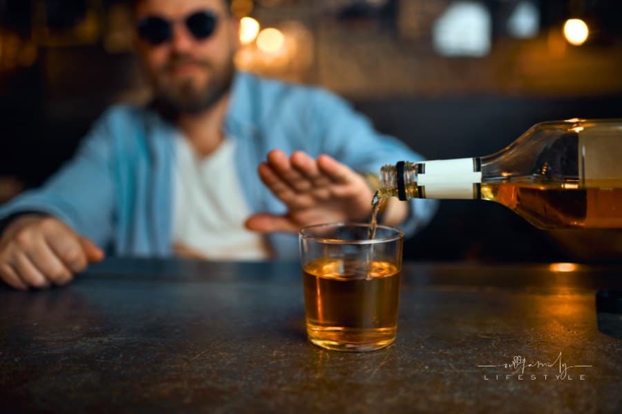 Man in Sunglasses Refuses to Drink Alcohol