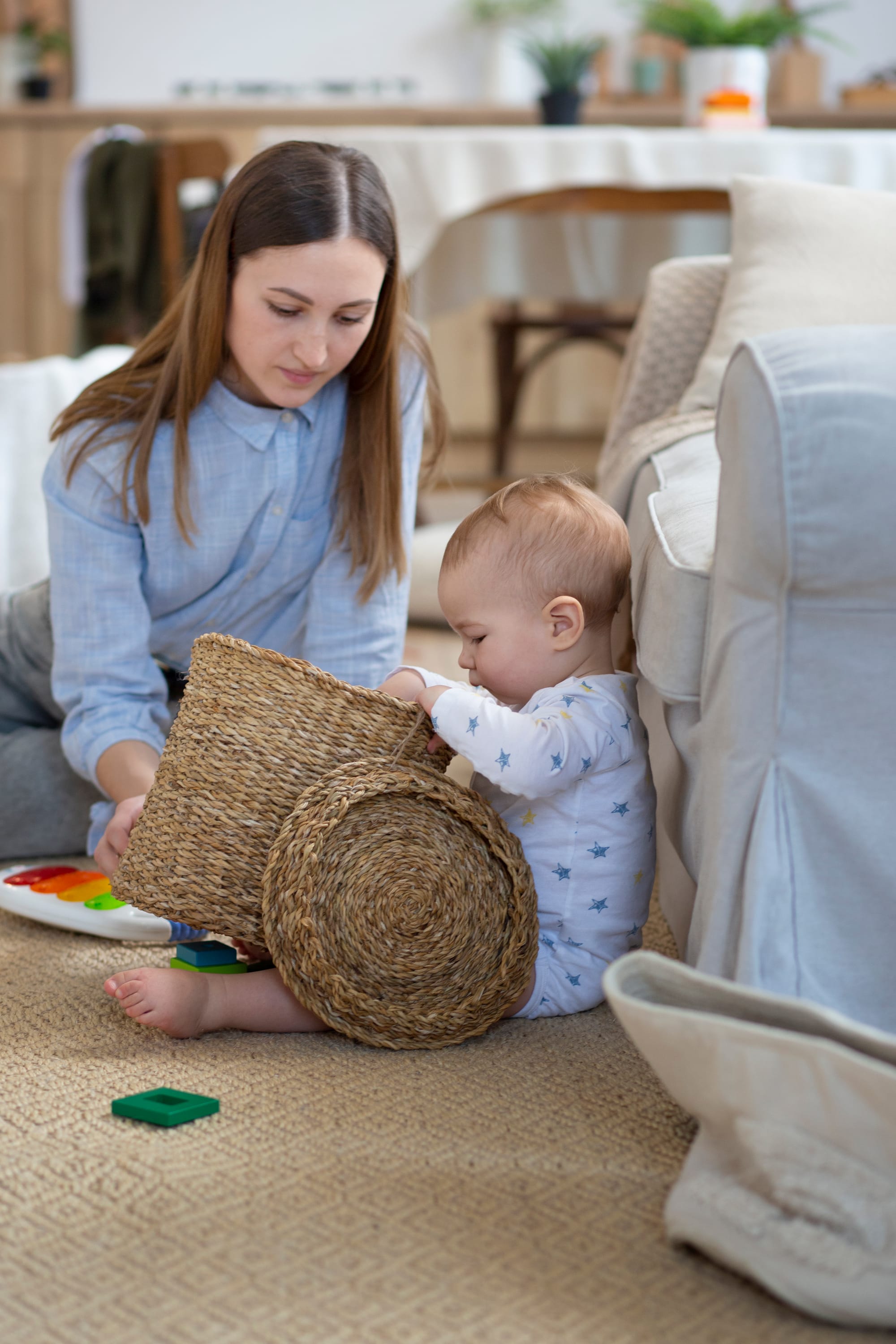 Mother and baby playing with toys