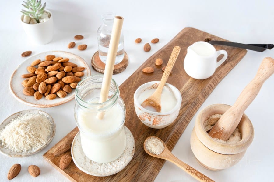 Close-up of homemade almond milk with an ecological bamboo straw