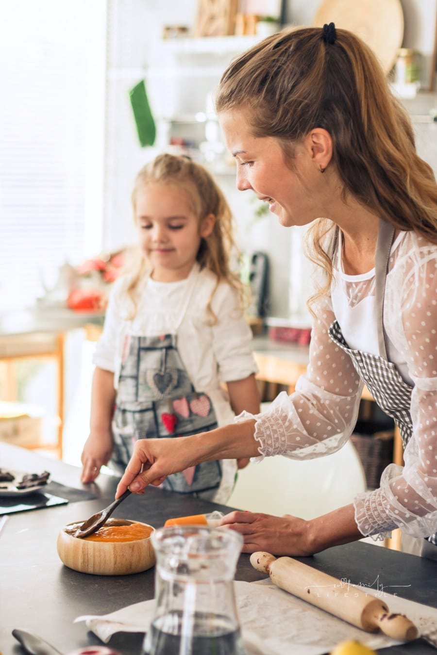 mom and daughter prepping vegan snack