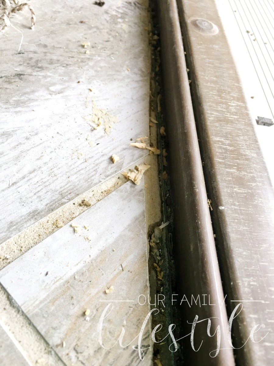 missing tile grout at door