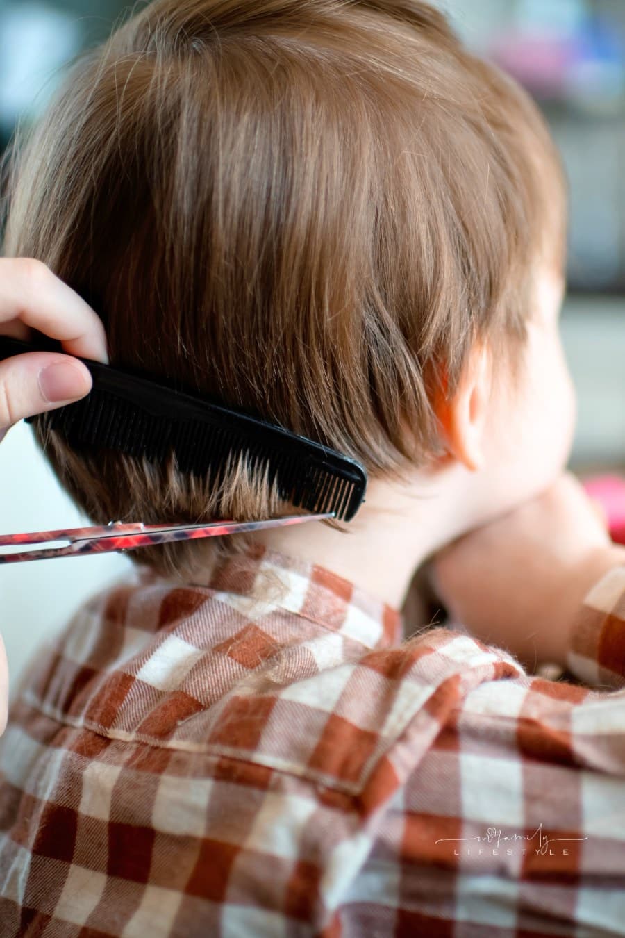 Mom Giving Toddler Son a Haircut at Home