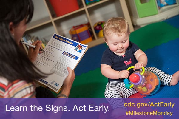 Mom using checklist with baby