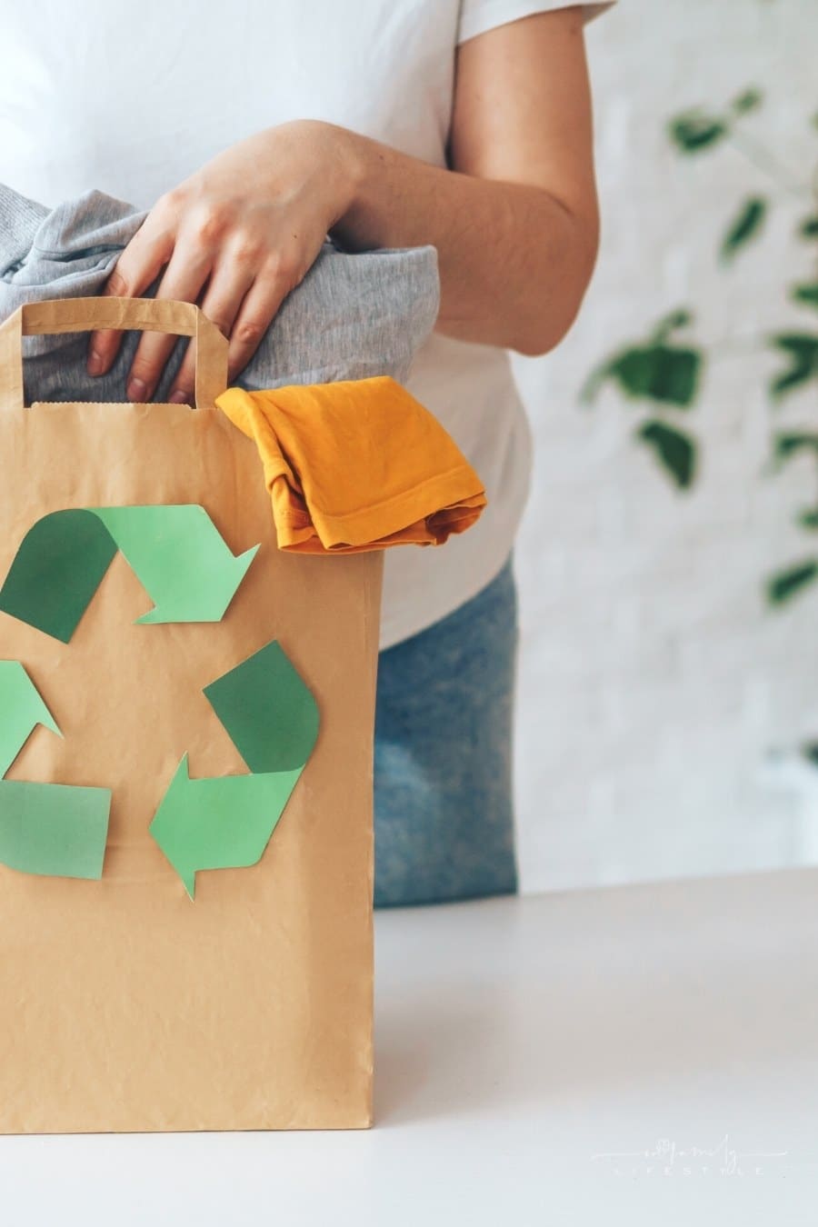 folded clothes in paper bag for recycling