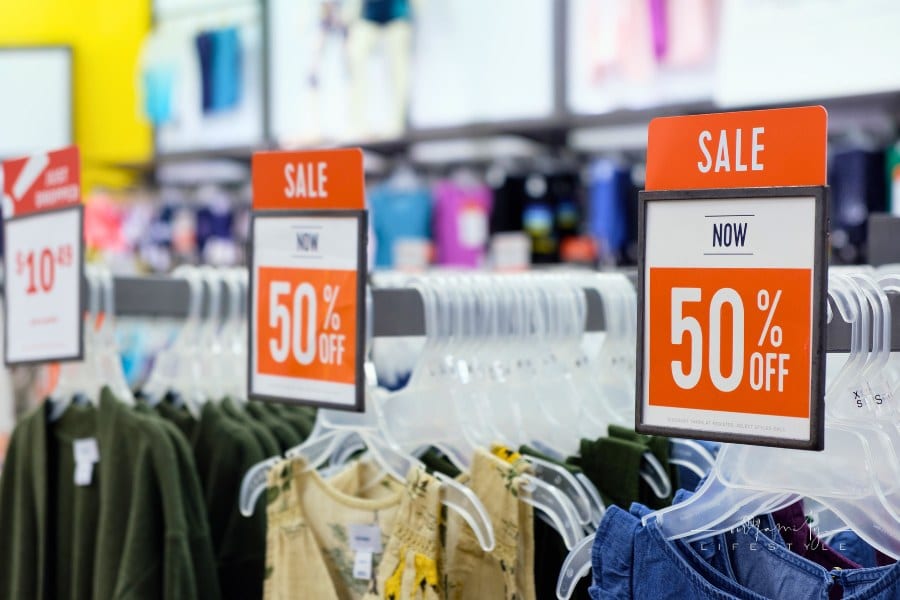 Red sale signs in store