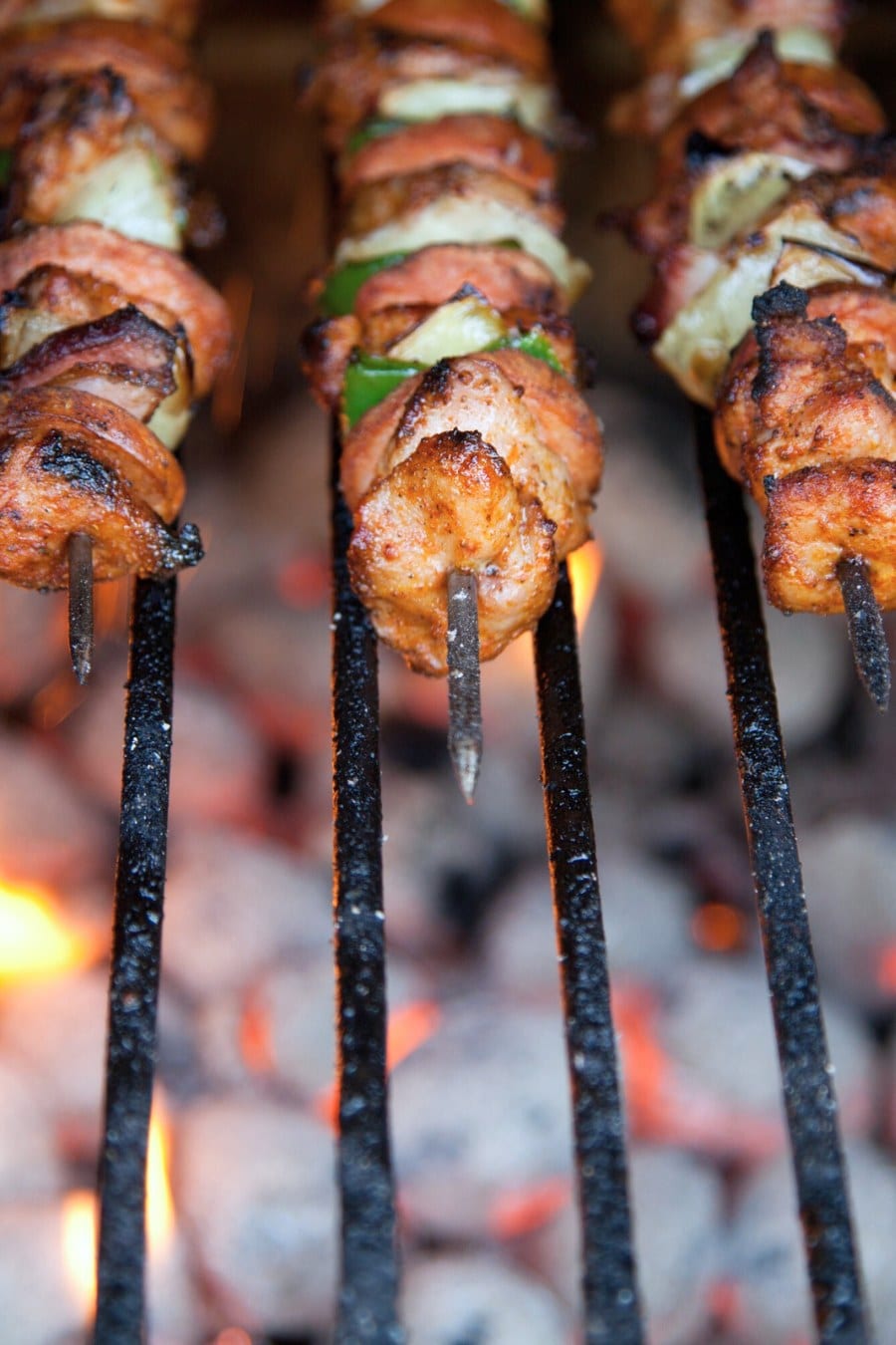 Cooking kabobs on a fire pit grill