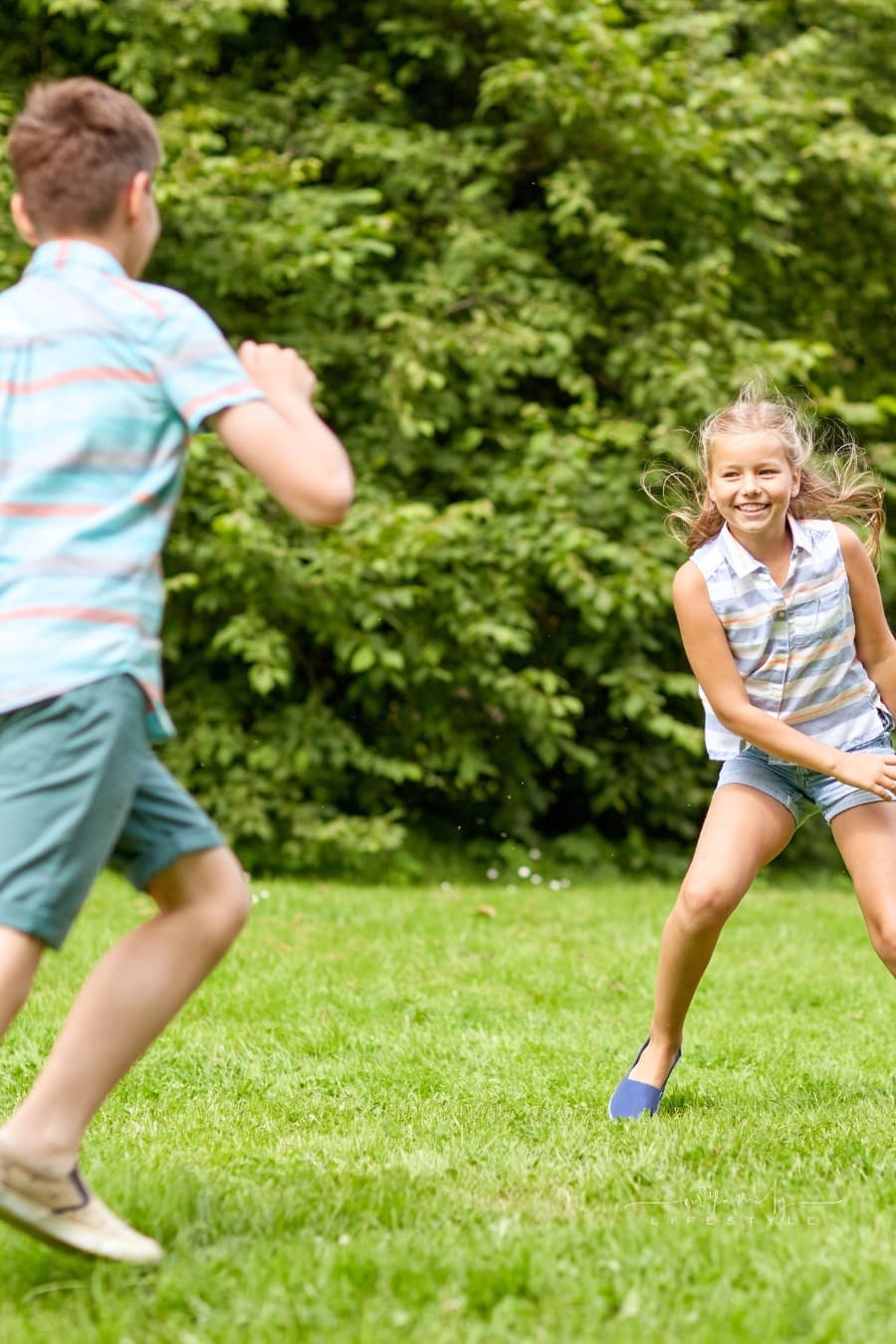 Happy Kids Running and Playing Game Outdoors