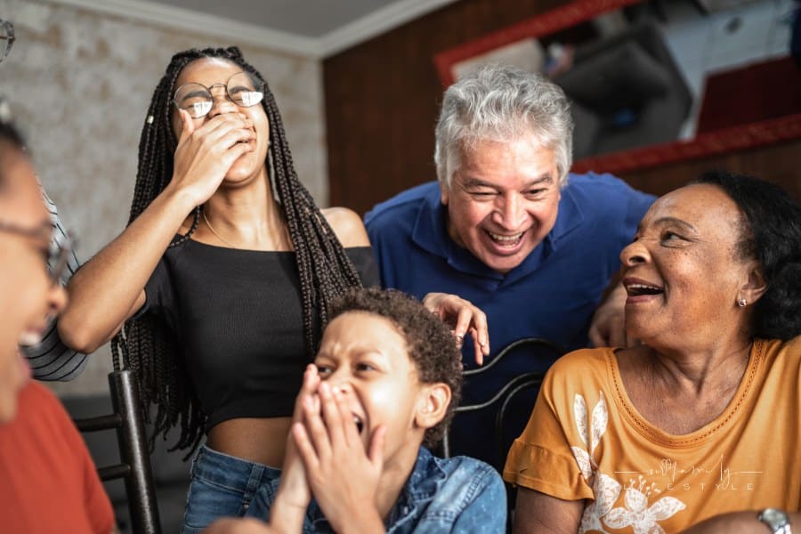 family and friends laughing while playing games