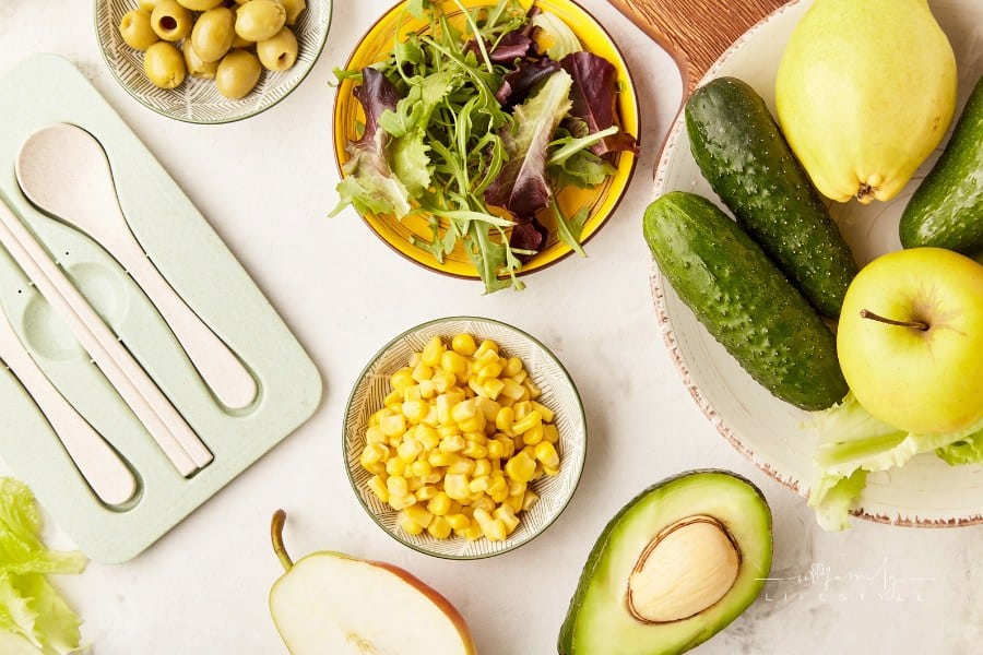 Plant based diet, Mediterranean diet - vegetables, fruits, greens, flax seeds ingredients with cutlery close up flat lay.