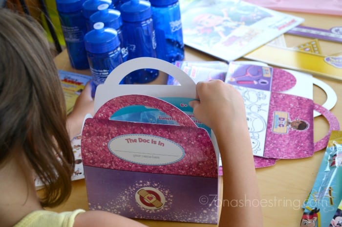 packing Doc McStuffins party bags