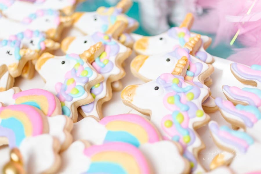 Unicorn sugar cookies decorated with royal icing at the kids birthday party.