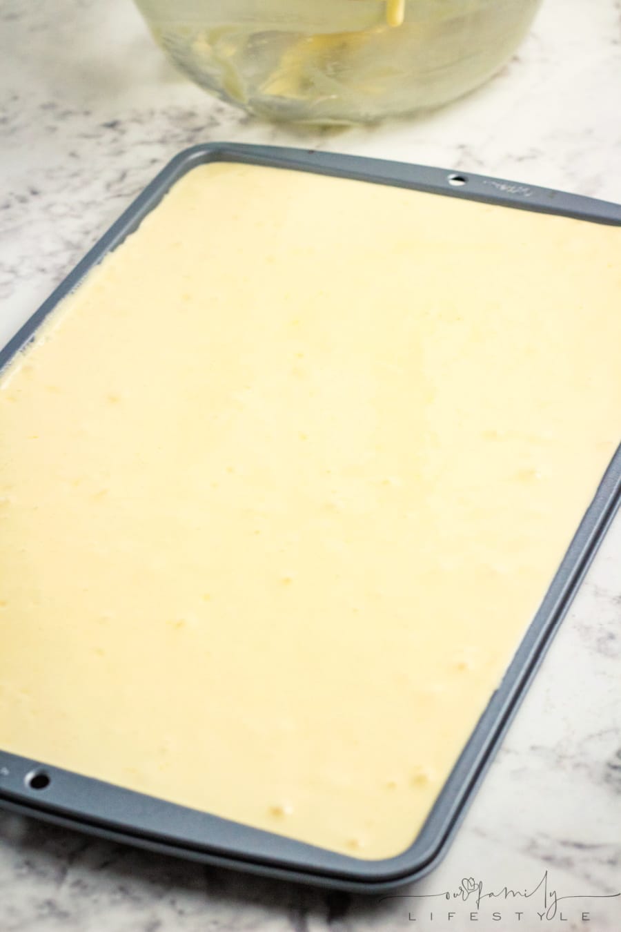 pour Swiss cake roll batter into cake pan