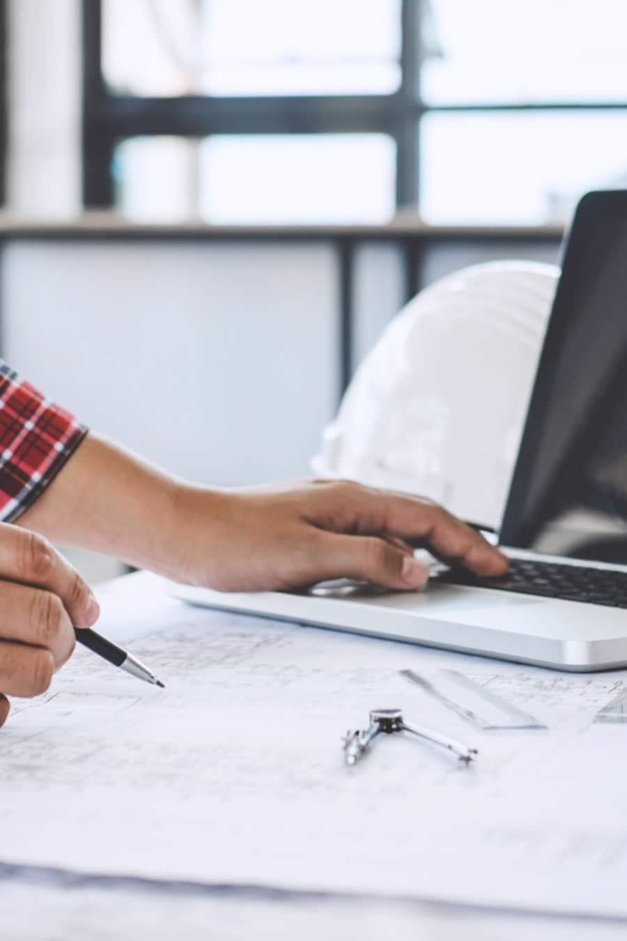 Construction Concept, Hands of Contractor Working on Laptop
