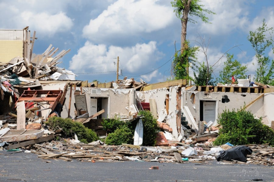 Two story building destroyed in tornado natural disaster.