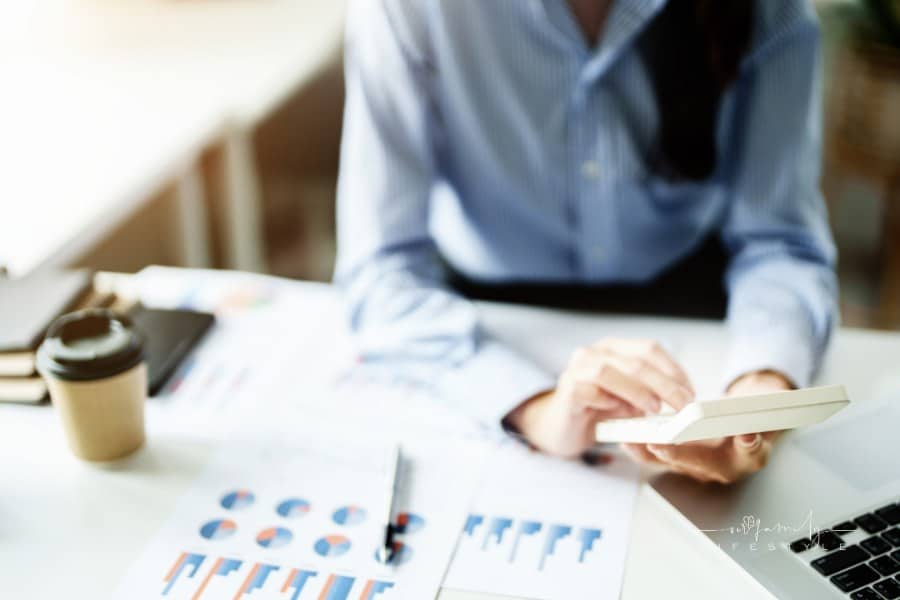 woman looking at investment calculator