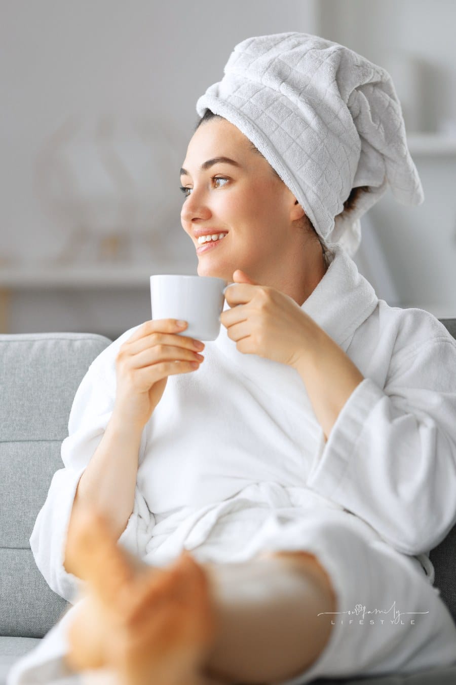 Woman Is Relaxing after a Bath with a Cup of Tea
