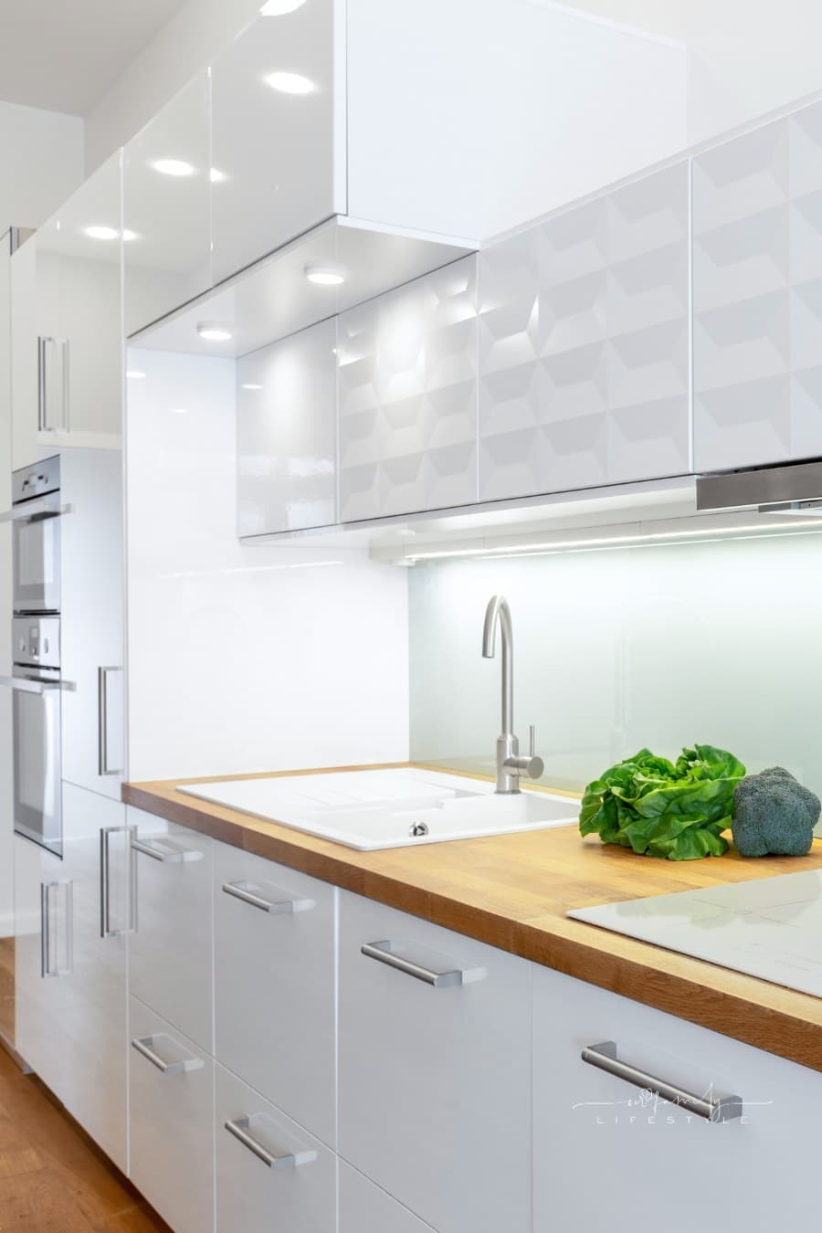 Elegant white kitchen with led lights